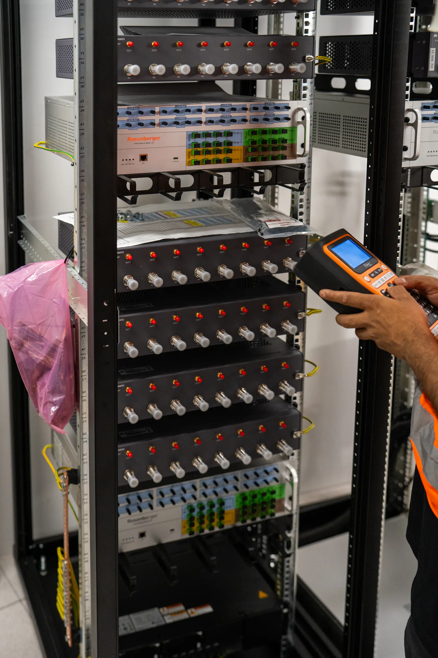Engineer testing a network rack